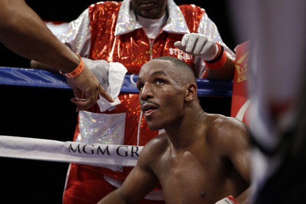Devon Alexander sits in his corner between rounds against Amir Khan during their welterweight bout Saturday, Dec. 13, 2014, in Las Vegas. (AP Photo/John Locher)
