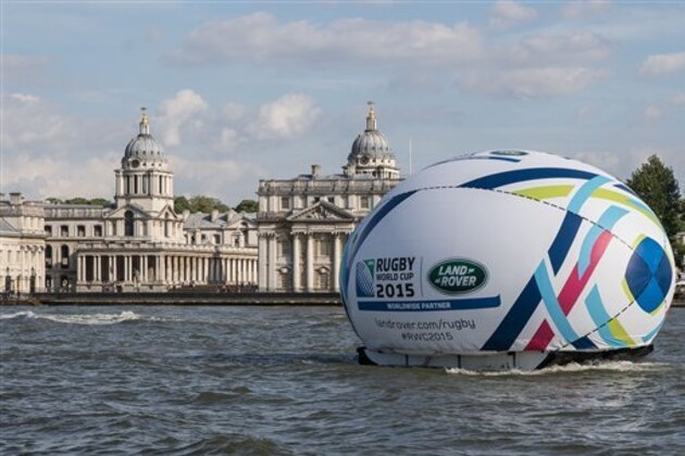 IMAGE DISTRIBUTED FOR LAND ROVER – Land Rover floats a giant 8.2 metre high rugby ball along the Thames to Tower Bridge to reveal the bespoke Rugby World Cup 2015 Land Rover Defender which features a tailor-made display cabinet to showcase the Webb Ellis Cup on Friday, May 22, 2015, in London, England.  The custom-built Defender will be transporting the Webb Ellis Cup on a 100-day tour around the UK and Ireland in the build-up to Rugby World Cup 2015.  Further details can be found at (http://goo.gl/n15D7a)  and (https://youtu.be/5J3KXRvsbNo) (Jeff Moore/Land Rover via AP Images)