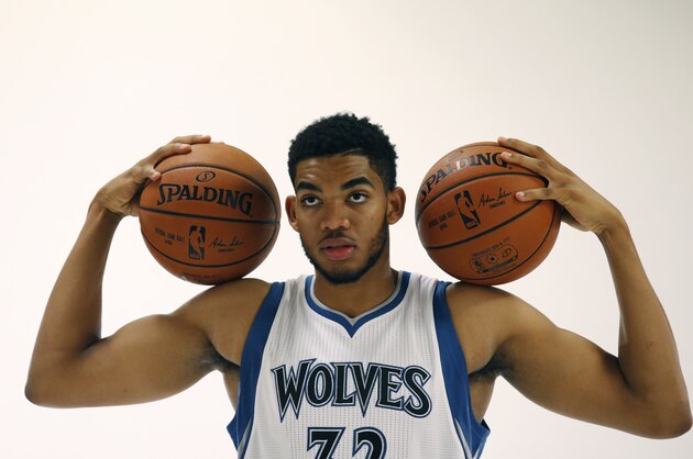 Minnesota Timberwolves center Karl-Anthony Towns (32) poses during  Timberwolves NBA media day in Minneapolis, Monday, Sept. 28, 2015. (AP Photo/Ann Heisenfelt)