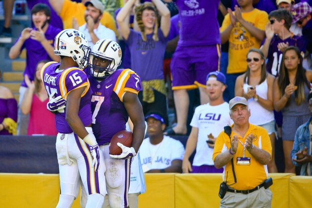 Oct 10, 2015; Baton Rouge, LA, USA; LSU Tigers running back Leonard Fournette (7) celebrates a touchdown with wide receiver Malachi Dupre (15) during the third quarter of a game at Tiger Stadium.  Mandatory Credit: Derick E. Hingle-USA TODAY Sports