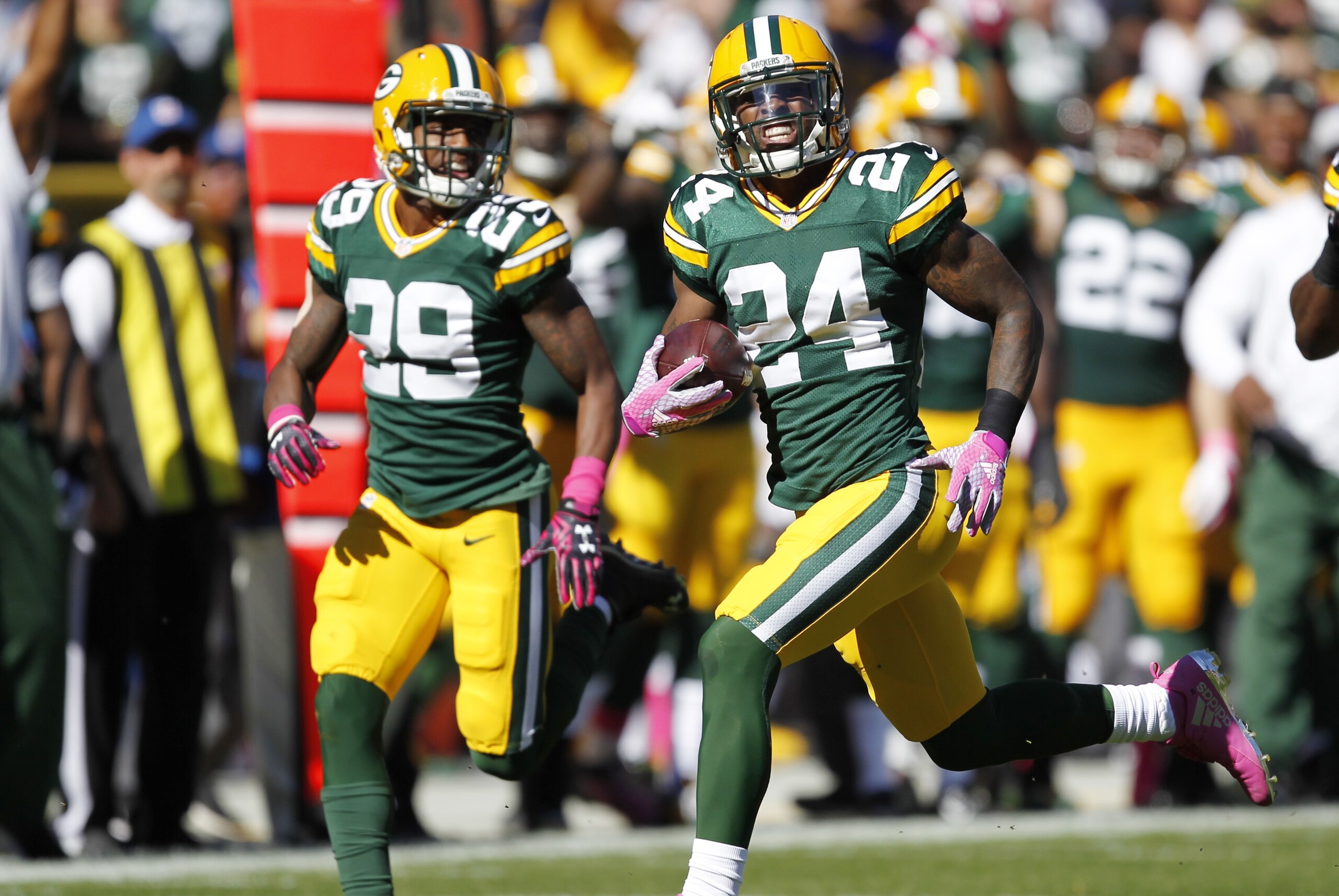 Green Bay Packers' Quinten Rollins (24) runs back an interception for a touchdown during the first half an NFL football game against the St. Louis Rams Sunday, Oct. 11, 2015, in Green Bay, Wis. (AP Photo/Matt Ludtke)