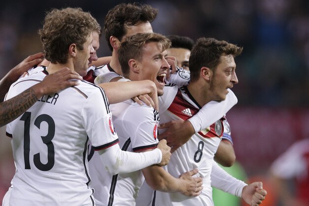 Germany's Max Kruse, center, celebrates after scoring his side's second goal during the Euro 2016 group D qualifying soccer match between Germany and Georgia in Leipzig, Germany, Sunday, Oct. 11, 2015. (AP Photo/Michael Sohn)