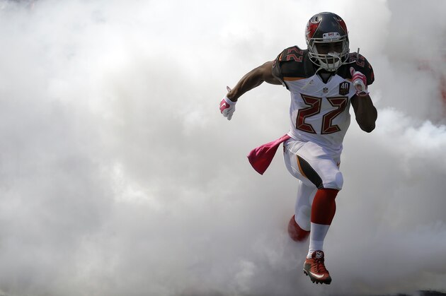 Tampa Bay Buccaneers running back Doug Martin (22) runs onto the field during team introductions before an NFL football game Jacksonville Jaguars Sunday, Oct. 11, 2015, in Tampa, Fla. (AP Photo/Chris O'Meara)