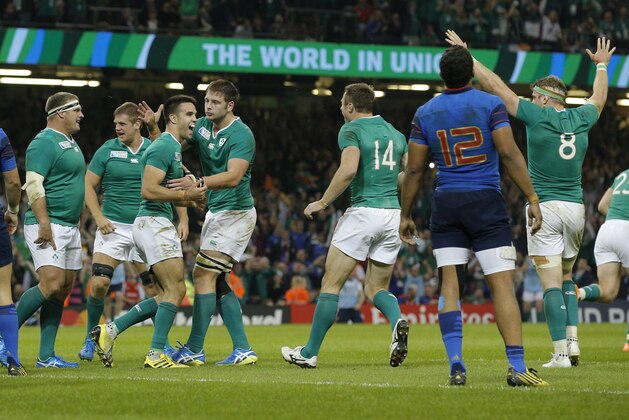 Ireland's Conor Murray, third left, celebrates scoring a try during the Rugby World Cup Pool D match between France and Ireland at the Millennium Stadium, Cardiff, Sunday, Oct. 11, 2015. (AP Photo/Christophe Ena)