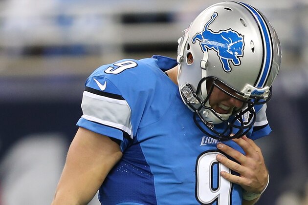 DETROIT MI - OCTOBER 11: Matthew Stafford of the Detroit Lions walks off the field holding his shoulder after being sacked by the Arizona Cardinals in the second quarter  on October 11, 2015 at Ford Field in Detroit, Michigan.  (Photo by Leon Halip/Getty Images)