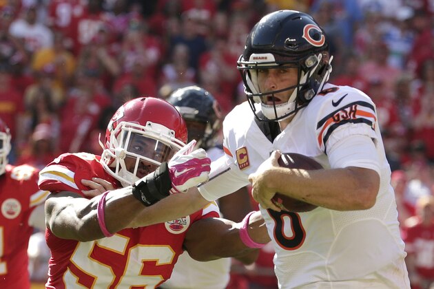 Chicago Bears quarterback Jay Cutler (6) breaks a tackle by Kansas City Chiefs linebacker Derrick Johnson (56) during the second half of an NFL football game in Kansas City, Mo., Sunday, Oct. 11, 2015. (AP Photo/Charlie Riedel)