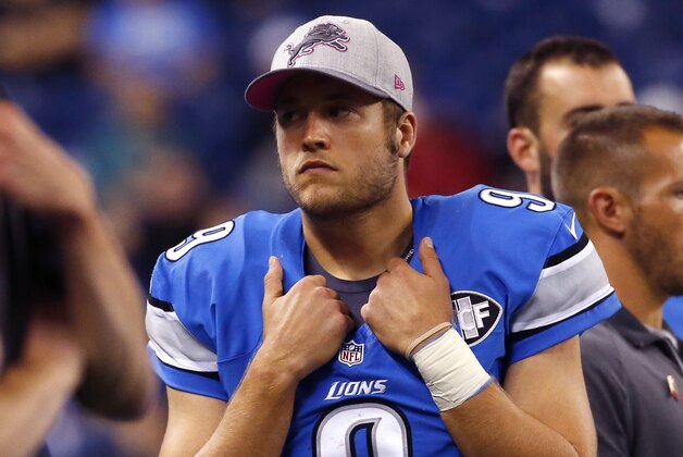 Detroit Lions quarterback Matthew Stafford (9) walks in the bench area during the second half of an NFL football game against the Arizona Cardinals, Sunday, Oct. 11, 2015, in Detroit. (AP Photo/Paul Sancya)