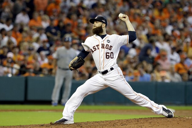 Houston Astros starting pitcher Dallas Keuchel throws against the Kansas City Royals during the seventh inning in Game 3 of baseball's American League Division Series Sunday, Oct. 11, 2015, in Houston. (AP Photo/Pat Sullivan)