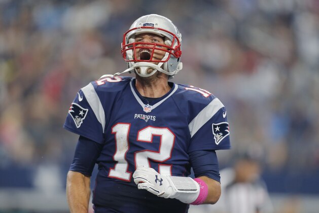 New England Patriots' Tom Brady celebrates after he score a touchdown against the Dallas Cowboys during the first half of an NFL football game, Sunday, Oct. 11, 2015, in Arlington, Texas. (AP Photo/Brandon Wade)