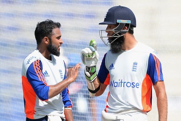 Adil Rashid of England speaks with Moeen Ali during a nets session at Zayed Cricket Stadium on October 11, 2015 in Abu Dhabi, United Arab Emirates.  (Photo by Gareth Copley/Getty Images)