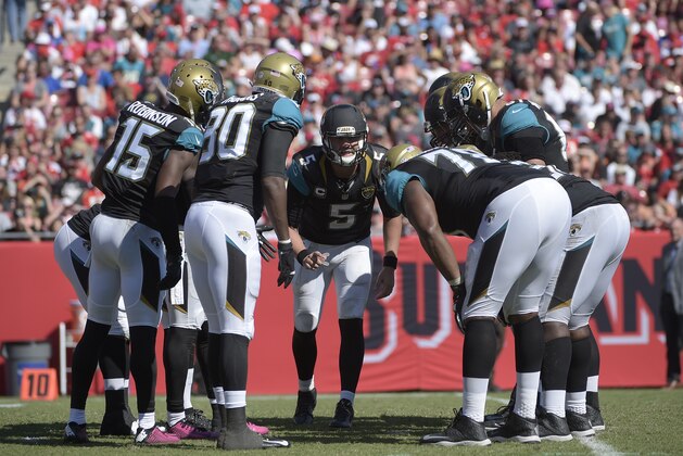 Jacksonville Jaguars quarterback Blake Bortles (5) calls a play in the huddle during the second half of an NFL football game against the Tampa Bay Buccaneers in Tampa, Fla., Sunday, Oct. 11, 2015. The Buccaneers won 38-31. (AP Photo/Phelan M. Ebenhack)
