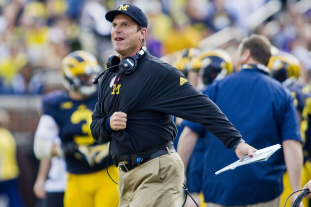 Michigan head coach Jim Harbaugh reacts to game officials from the sideline in the second quarter of an NCAA college football game against Northwestern in Ann Arbor, Mich., Saturday, Oct. 10, 2015. (AP Photo/Tony Ding)