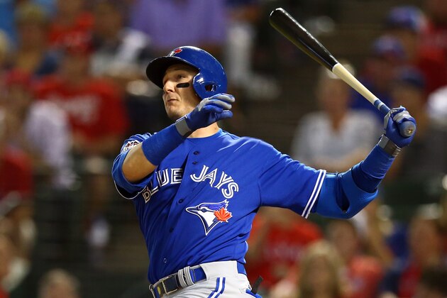 ARLINGTON, TX - OCTOBER 11:  Troy Tulowitzki #2 of the Toronto Blue Jays hits a single in the eighth inning against Ross Ohlendorf #51 of the Texas Rangers during game three of the American League Division Series on October 11, 2015 in Arlington, Texas.  (Photo by Ronald Martinez/Getty Images)