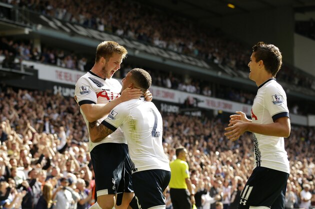Tottenham Hotspur's Eric Dier, left, celebrates scoring his side's first goal with Kyle Walker and Erik Lamela, right, during the English Premier League soccer match between Tottenham Hotspur and Manchester City at White Hart Lane stadium in London, Saturday, Sept. 26, 2015.  (AP Photo/Matt Dunham)