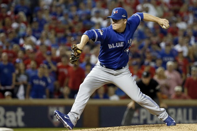 Toronto Blue Jays relief pitcher Aaron Loup (62) pitches against the Texas Rangers during the seventh inning in Game 3 of baseball's American League Division Series Sunday, Oct. 11, 2015, in Arlington, Texas. (AP Photo/Tony Gutierrez)