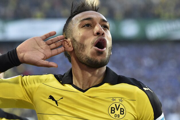 Dortmund's Pierre-Emerick Aubameyang celebrates after scoring his second goal during the German Bundesliga soccer match between Borussia Dortmund and SV Darmstadt in Dortmund, Germany, Sunday, Sept. 27, 2015. (AP Photo/Martin Meissner)