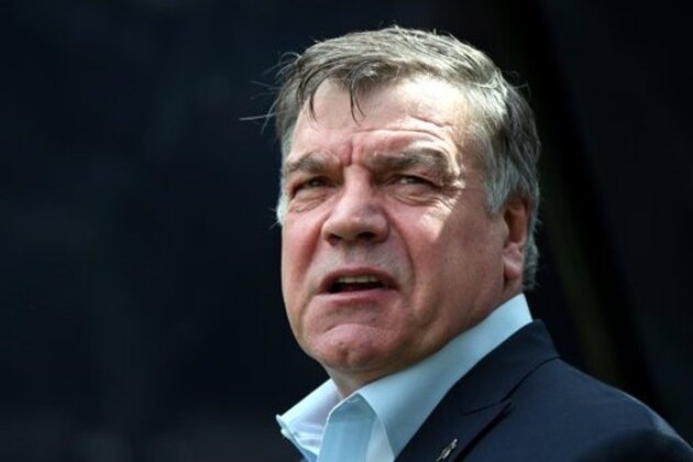 FILE - In this Sunday, May 24, 2015 file photo, Sam Allardyce waits at the start of their English Premier League soccer match between Newcastle United and West Ham United's  at St James' Park, Newcastle, England. Sunderland says it has hired Sam Allardyce as its new manager on a two-year contract. Allardyce replaces Dick Advocaat after the Dutchman quit last weekend following a 2-2 draw at home to West Ham. Sunderland surrendered a two-goal lead in the game and has only three points from eight matches so far in the Premier League, leaving it second from bottom in the standings. Allardyce says “I hope to be able to help to bring the stability and success that everyone wants.” (AP Photo/Scott Heppell, file)