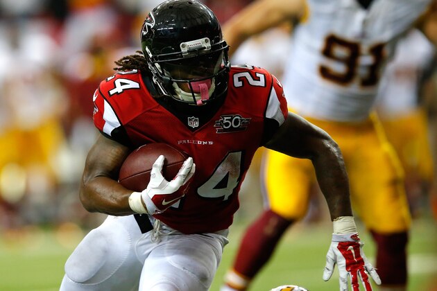 ATLANTA, GA - OCTOBER 11:  Devonta Freeman #24 of the Atlanta Falcons rushes for a touchdown in the final minutes of regulation against the Washington Redskins at Georgia Dome on October 11, 2015 in Atlanta, Georgia.  (Photo by Kevin C. Cox/Getty Images)