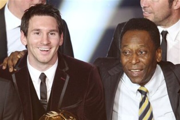 FILE - In this Jan. 9, 2012, file photo,  Argentina's Lionel Messi, left, and Brazil's soccer legend Pele stand together after Messi was awarded the FIFA Ballon d'Or award in Zurich, Switzerland. Pele says Messi still needs to improve at international level before he can be considered the greatest soccer player ever and needs to score more goals to come close to matching the Brazilian great. (AP Photo/Michael Probst, File)