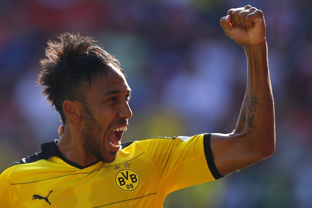 Dortmund's Pierre-Emerick Aubameyang celebrates after scoring his side's fourth goal during the German Bundesliga soccer match between FC Ingolstadt 04 and Borussia Dortmund in Ingolstadt, Germany, Sunday, Aug. 23, 2015. (AP Photo/Matthias Schrader)