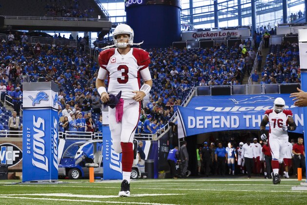 Arizona Cardinals quarterback Carson Palmer (3) during player introductions prior to an NFL football game against the Detroit Lions at Ford Field in Detroit, Sunday, Oct. 11, 2015. (AP Photo/Rick Osentoski)