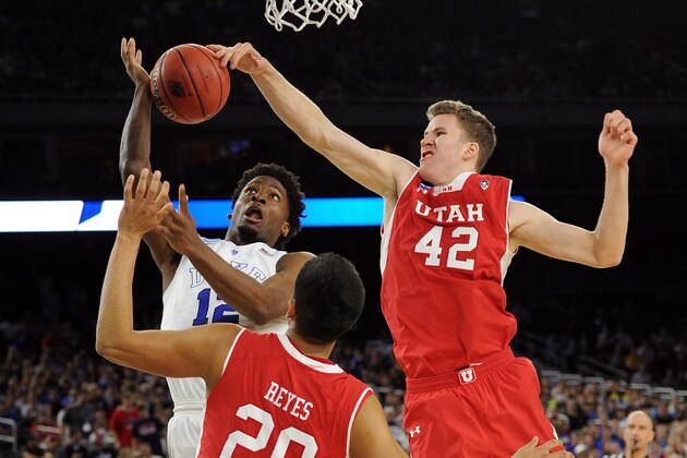 HOUSTON, TX - MARCH 27: Jakob Poeltl #42 of the Utah Utes defends a shot by Justise Winslow #12 of the Duke Blue Devils during the South Regional Semifinal round of the 2015 NCAA Men's Basketball Tournament at NRG Stadium on March 27, 2015 in Houston, Texas. Duke won 63-57. (Photo by Lance King/Getty Images)