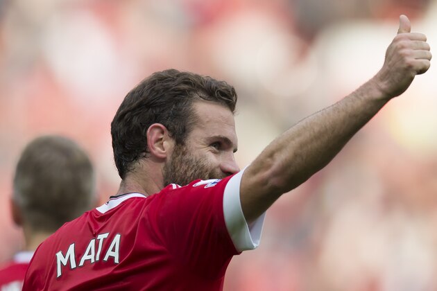 Manchester United's Juan Mata celebrates after scoring during the English Premier League soccer match between Manchester United and Sunderland at Old Trafford Stadium, Manchester, England, Saturday, Sept. 26, 2015. (AP Photo/Jon Super)