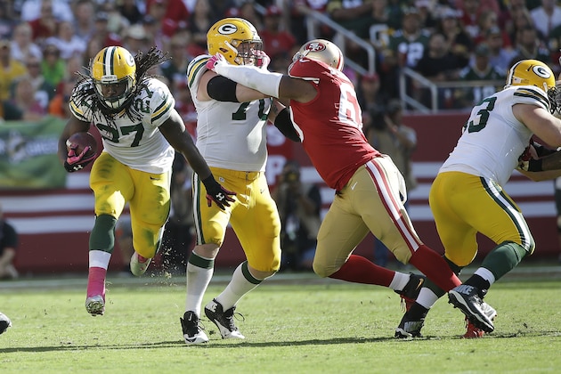 Green Bay Packers running back Eddie Lacy (27) runs behind a block by guard T.J. Lang during the second half of an NFL football game against the San Francisco 49ers in Santa Clara, Calif., Sunday, Oct. 4, 2015. (AP Photo/Marcio Jose Sanchez) Green Bay Packers running back Eddie Lacy (27) runs behind a block by guard T.J. Lang during the second half of an NFL football game against the San Francisco 49ers in Santa Clara, Calif., Sunday, Oct. 4, 2015. (AP Photo/Marcio Jose Sanchez)