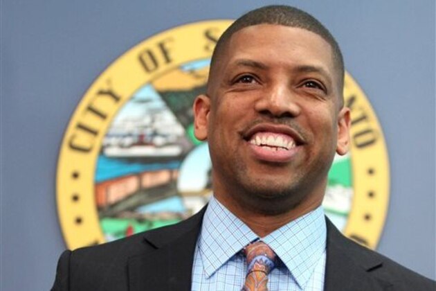 FILE - In this Feb. 22, 2012, file photo, Sacramento Mayor Kevin Johnson smiles during a news conference in Sacramento, Calif. Johnson, 48, has been on a winning streak keeping the Sacramento Kings from relocating to Seattle, serving as the new leader of the U.S. Conference of Mayors and representing the NBA players in the Sterling scandal surrounding Los Angeles Clippers Donald Sterling.(AP Photo/Rich Pedroncelli, File)