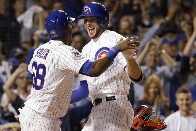 Chicago Cubs' Kris Bryant, right, celebrates with Jorge Soler (68) after hitting a two-run home run against the St. Louis Cardinals during the fifth inning of Game 3 in baseball's National League Division Series, Monday, Oct. 12, 2015, in Chicago. (AP Photo/Nam Y. Huh)