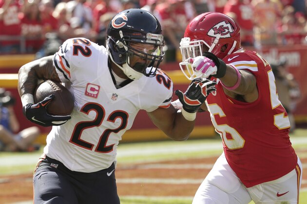 Chicago Bears running back Matt Forte (22) tries to run past Kansas City Chiefs linebacker Derrick Johnson (56) during the first half of an NFL football game in Kansas City, Mo., Sunday, Oct. 11, 2015. (AP Photo/Charlie Riedel)