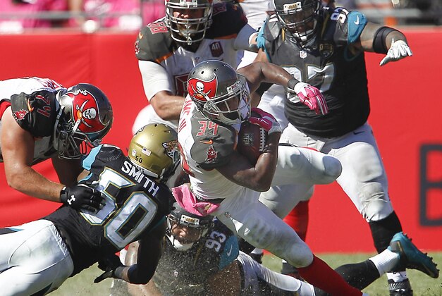 Oct 11, 2015; Tampa, FL, USA; Tampa Bay Buccaneers running back Charles Sims (34) dives for a first down during the second half of an NFL football game against the Jacksonville Jaguars at Raymond James Stadium. Tampa won 38-31. Mandatory Credit: Reinhold Matay-USA TODAY Sports
