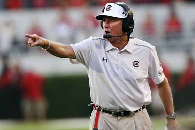 South Carolina coach Steve Spurrier motions to his team from the sideline during the first half of an NCAA college football game against Georgia on Saturday, Sept. 19, 2015, in Athens, Ga. (AP Photo/John Bazemore)