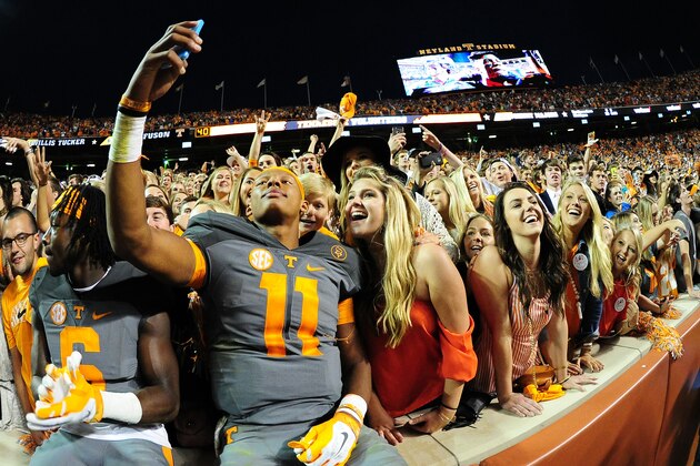 KNOXVILLE, TN - OCTOBER 10: Joshua Dobbs #11 of the Tennessee Volunteers takes a selfie with fans after the game against the Georgia Bulldogs on October 10, 2015 at Neyland Stadium in Knoxville, Tennessee. (Photo by Scott Cunningham/Getty Images)