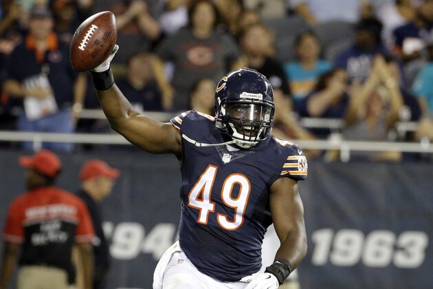 Chicago Bears linebacker Sam Acho (49) celebrates an interception against the Miami Dolphins during the second half of an NFL preseason football game in Chicago, Thursday, Aug. 13, 2015. (AP Photo/Nam Y. Huh)