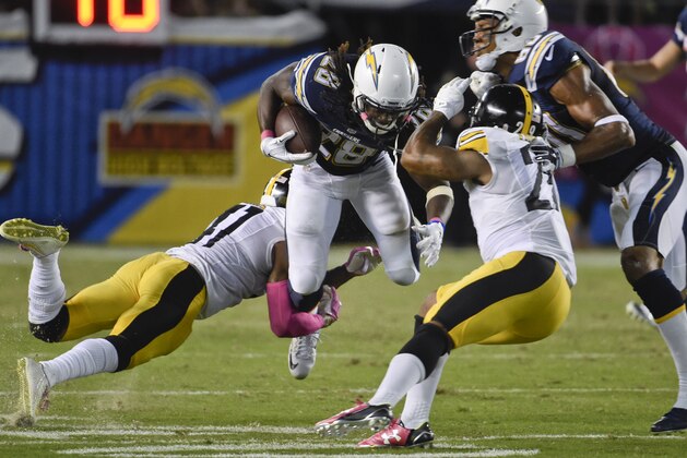 San Diego Chargers running back Melvin Gordon is tackled by Pittsburgh Steelers cornerback Antwon Blake during the second half of an NFL football game Monday, Oct. 12, 2015, in San Diego. (AP Photo/Denis Poroy)