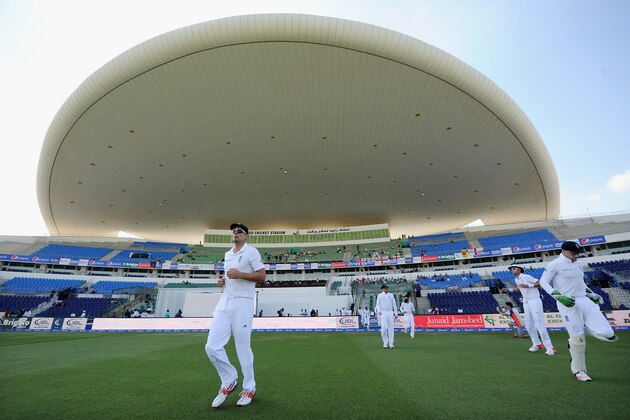 ABU DHABI, UNITED ARAB EMIRATES - OCTOBER 13:  England captain Alastair Cook leads his team out ahead of the 1st Test between Pakistan and England at Zayed Cricket Stadium on October 13, 2015 in Abu Dhabi, United Arab Emirates.  (Photo by Gareth Copley/Getty Images)