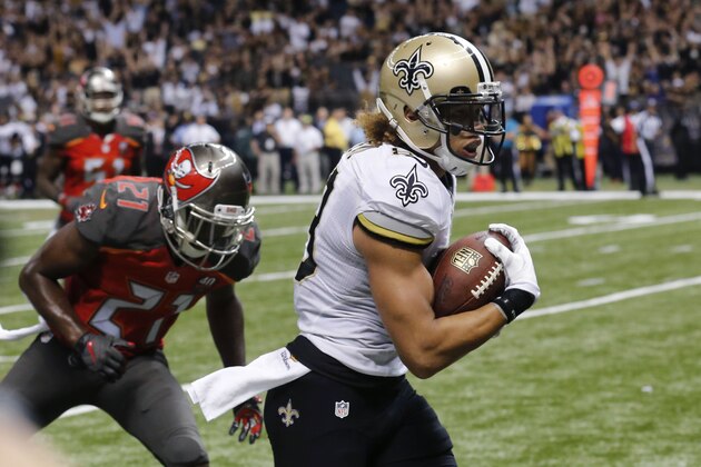 New Orleans Saints wide receiver Willie Snead (83) scores on a touchdown reception in front of Tampa Bay Buccaneers cornerback Alterraun Verner (21) in the second half of an NFL football game in New Orleans, Sunday, Sept. 20, 2015. (AP Photo/Bill Haber)