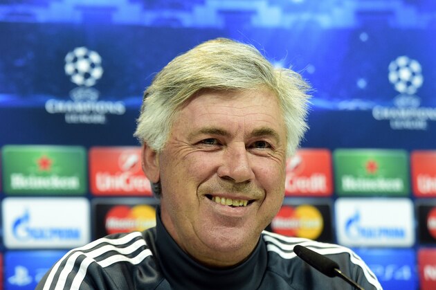 Real Madrid's Italian coach Carlo Ancelotti smiles during a press conference at Valdebebas training ground in Madrid on May 12, 2015, on the eve of the UEFA Champions League semi-final second leg football match Real Madrid CF vs Juventus.  AFP PHOTO/ GERARD JULIEN        (Photo credit should read GERARD JULIEN/AFP/Getty Images)
