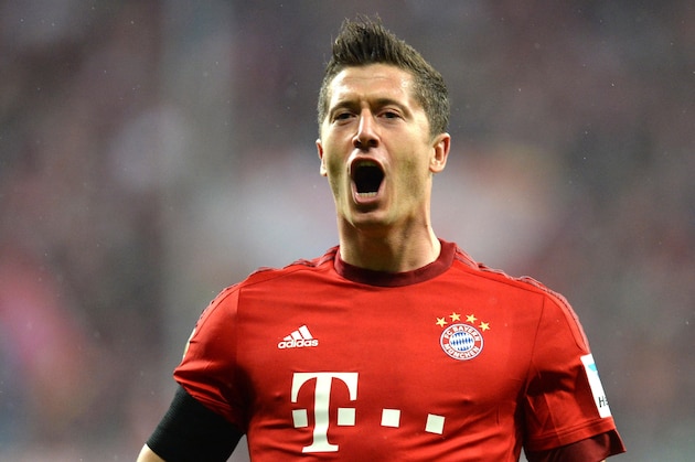 Bayern Munich's Polish striker Robert Lewandowski celebrates after the third goal for Munich during the German first division Bundesliga football match FC Bayern Muenchen vs VfL Wolfsburg in Munich, on September 22, 2015.    AFP PHOTO / CHRISTOF STACHE

RESTRICTIONS: DURING MATCH TIME: DFL RULES TO LIMIT THE ONLINE USAGE TO 15 PICTURES PER MATCH AND FORBID IMAGE SEQUENCES TO SIMULATE VIDEO. 
==RESTRICTED TO EDITORIAL USE ==
FOR FURTHER QUERIES PLEASE  CONTACT THE  DFL DIRECTLY AT + 49 69 650050.        (Photo credit should read CHRISTOF STACHE/AFP/Getty Images)