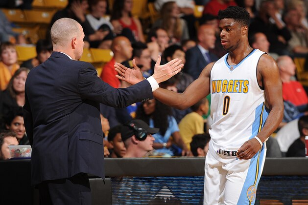 BOULDER, CO - OCTOBER 8:  Emmanuel Mudiay #0 of the Denver Nuggets and head coach Michael Malone of the Denver Nuggets shakes hands during a preseason game against the Chicago Bulls on October 8, 2015 at the Coors Event Center in Boulder, Colorado. NOTE TO USER: User expressly acknowledges and agrees that, by downloading and/or using this Photograph, user is consenting to the terms and conditions of the Getty Images License Agreement. Mandatory Copyright Notice: Copyright 2015 NBAE (Photo by Bart Young/NBAE via Getty Images)