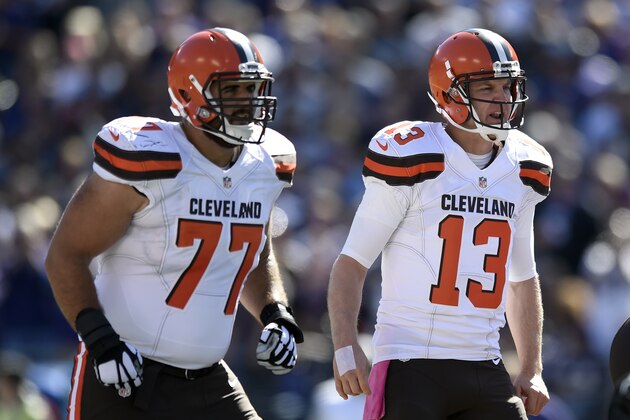 Cleveland Browns quarterback Josh McCown (13) prepares for a play alongside teammate John Greco in the first half of an NFL football game against the Baltimore Ravens, Sunday, Oct. 11, 2015, in Baltimore. (AP Photo/Gail Burton)