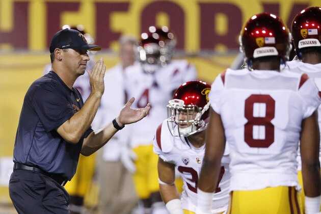 Southern California head coach Steve Sarkisian applauds his players as they warm up prior to an NCAA college football game against Arizona State Saturday, Sept. 26, 2015, in Tempe, Ariz. (AP Photo/Ross D. Franklin)