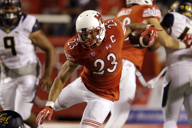 Utah running back Devontae Booker (23) carries the ball in the first half during an NCAA college football game against California Saturday, Oct. 10, 2015, in Salt Lake City. (AP Photo/Rick Bowmer)