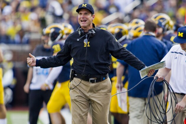 Michigan head coach Jim Harbaugh reacts to game officials from the sideline in the second quarter of an NCAA college football game against Northwestern in Ann Arbor, Mich., Saturday, Oct. 10, 2015. (AP Photo/Tony Ding)