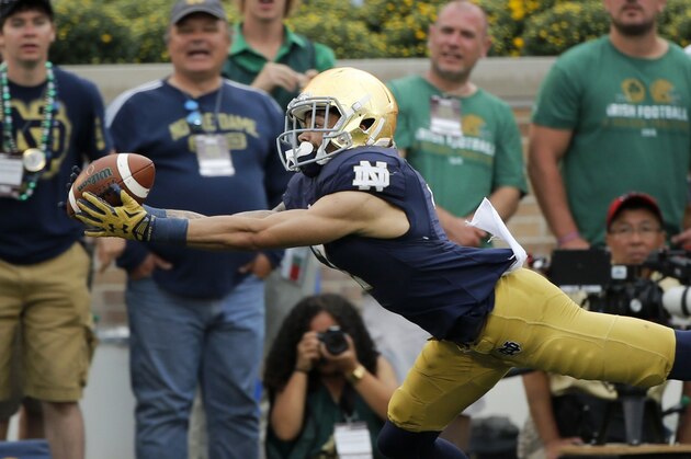 Notre Dame's Will Fuller makes a diving grab on a pass from DeShone Kizer during the second half of an NCAA college football game against Massachusetts, Saturday, Sept. 26, 2015, in South Bend, Ind. Upon review the pass was ruled incomplete. Notre Dame won 62-27. (AP Photo/Charles Rex Arbogast)