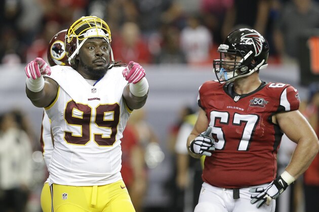Washington Redskins defensive tackle Ricky Jean Francois (99) gestures to the bench after the Atlanta Falcons touchdown was called back during the second half of an NFL football game, Sunday, Oct. 11, 2015, in Atlanta. The Atlanta Falcons won 25-19. (AP Photo/Brynn Anderson)