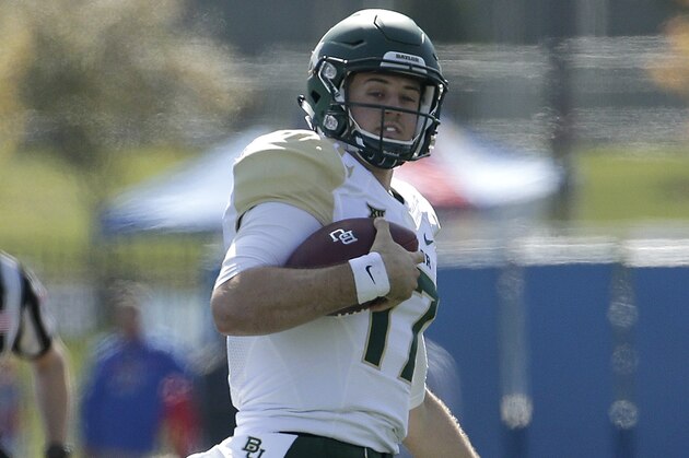 Baylor quarterback Seth Russell (17) runs the ball during the first half of an NCAA college football game against Kansas Saturday, Oct. 10, 2015, in Lawrence, Kan. (AP Photo/Charlie Riedel)