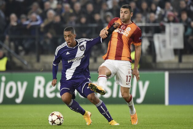Anderlecht's Youri Tielemans, left, and Galatasaray's Burak Yilmaz vie for the ball during the Group D Champions League match between Anderlecht and Galatasaray at Constant Vanden Stock Stadium in Brussels, Belgium, Wednesday Nov. 26, 2014. (AP Photo/Geert Vanden Wijngaert)
