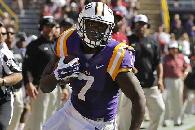 LSU running back Leonard Fournette (7) runs against South Carolina safety D.J. Smith (24) during the first half of an NCAA college football game in Baton Rouge, La., Saturday, Oct. 10, 2015. (AP Photo/Jonathan Bachman)